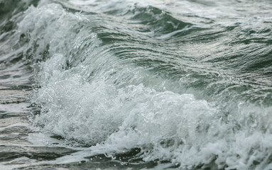 Wave in the sea with splashing water.