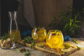 Homemade fruit tea with sea buckthorn, lime, rosemary, star anise and chia seeds