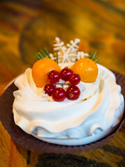 Christmas delicious cakes decorated with a gingerbread snowflake, cranberries, physalis.