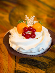 Christmas delicious cakes decorated with a gingerbread snowflake, cranberries, physalis.