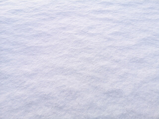 Obraz premium Snow in the rays of the sunset as a background.