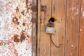 wood door with lock and metal wall