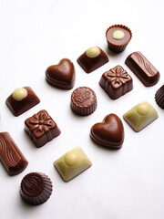 Variety of chocolate truffles isolated on white background.