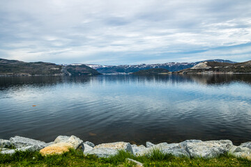 Red chairs and view from Eastern Arm of Bonne Bay. Gros Morne National Park, Newfoundland, Canada