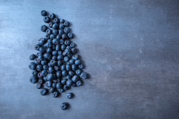 Fresh blueberries background with copy space for your text. Vegan and vegetarian concept. Healthy summer food. Blueberry berries texture close up