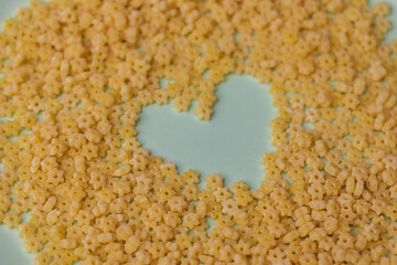 Heart on a plate of pasta. Lots of little flour stars.