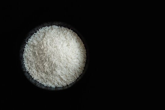 Rice In A Bowl On Black Background Top Down View