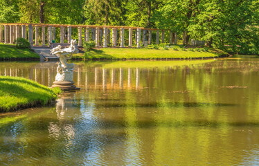 Fototapeta na wymiar Pond shore in an old park
