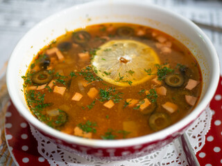 Ukrainian and russian national red borsch with lemon slice