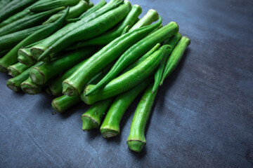 Fresh okra, lady finger, on gray table