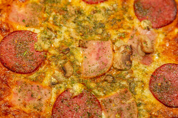 Obraz na płótnie Canvas Textured surface of cheese pizza with spices. Homemade fresh baking recipe