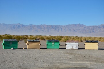 Colorful waste containers on a campground in Stovepipe Wells in California, Death Valley National...