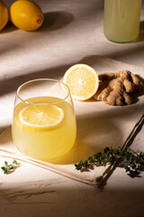 Glass of lemonade with ginger and lemon