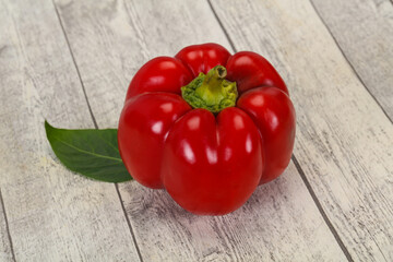 Ripe Red bell pepper over wooden