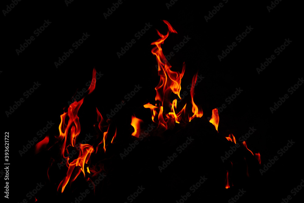 Poster closeup shot of beautiful burning flames at night