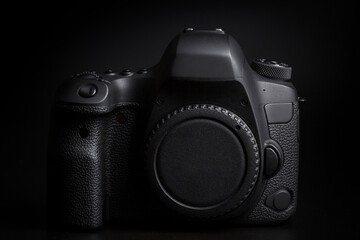 DSLR camera body on black background