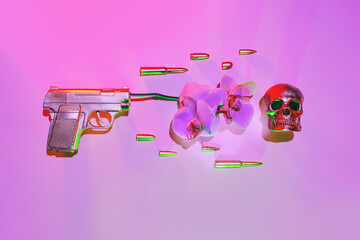 The golden gun shoots an orchid flower, next to fly bullets on a pink background, the concept...