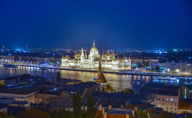 Parliament and cruises in the Danube at night in Budapest,Hungary