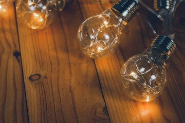 Light bulbs over wooden background