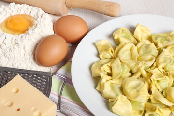 Tortellini stuffed with spinach and ricotta. Covered with grated cheese.