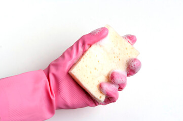 Hand in a pink rubber glove holding a sponge, isolated on white background
