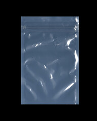 A little big bag made of an opaque plastic material, rectangular shape. Used to safely store items or electronics. Isolated on a black background.
