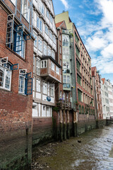 Fototapeta na wymiar Old classic buildings next to a canal, Hamburg, Germany