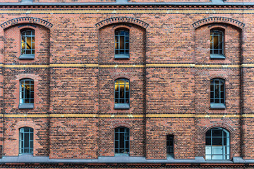 Facade of an old warehouse as background in Hamburg, Germany