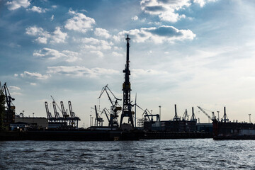 Fototapeta na wymiar Container cranes in the port of Hamburg, Germany