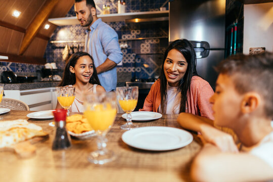 Latin Family Having Dinner At Home