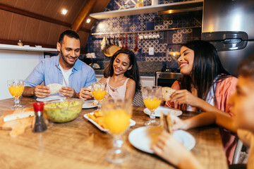 Latin family having dinner at home