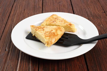 Piece of Spanish omelette on plate