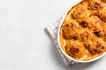 Baked vegetarian meatballs in a baking dish. Space for text, top view.