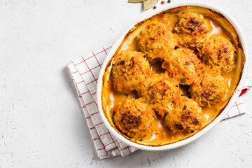 Baked meatballs with garlic tomato sauce in a baking dish. Space for text, top view.
