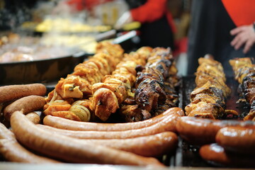 Food booth selling traditional Polish street food at a Christmas Market stall in Krakow, Poland. Traditional Polish street food in Cracow. 