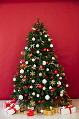 Christmas tree with gifts in the interer lights garland decor new year