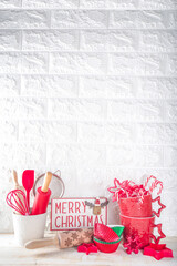 Christmas Baking Utensils. Confectioner or Baker Workplace, with Utensils and accessories for making  festive Christmas sweet cookies, cakes. White kitchen background with space for text or logo