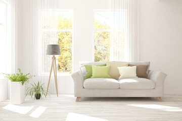 Stylish room in white color with sofa and autumn landscape in window. Scandinavian interior design. 3D illustration
