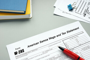  Financial concept meaning Form W-2AS American Samoa Wage and Tax Statement with sign on the sheet.