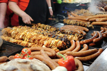 Food booth selling traditional Polish street food at a Christmas Market stall in Krakow, Poland. Traditional Polish street food in Cracow. 