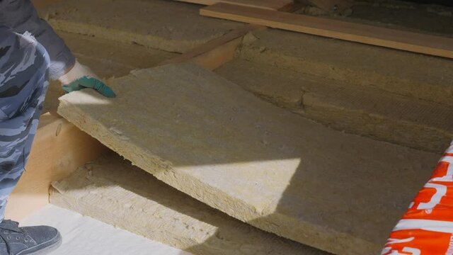 Construction work. Installation of insulation using.