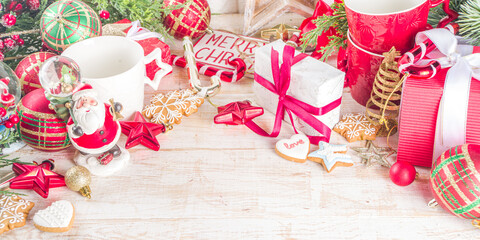 Christmas greeting cad background with decor, baubles, Xmas Gift Boxes, snow globe, hot chocolate...