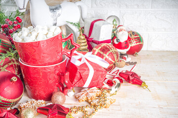 Christmas greeting cad background with decor, baubles, Xmas Gift Boxes, snow globe, hot chocolate...