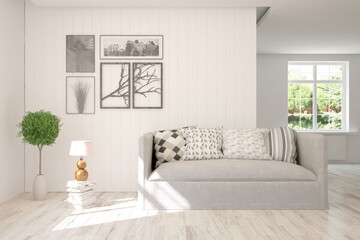 White living room with sofa and summer landscape in window. Scandinavian interior design. 3D illustration