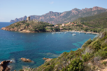 Coastal Village of Girolata in Corsica, France next to the vibrant blue Mediterranean sea