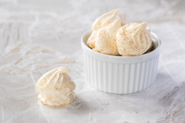 Meringues, close up. High key image 