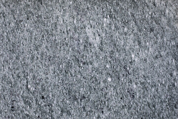 Gray polished marble surface with fine white dots, natural stone background for design