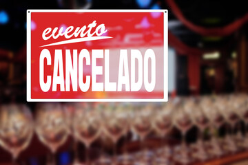 EVENT CANCELLED sign saying in spanish, Empty restaurant without people, financial losses of business, quarantine concept, precautions during a pandemic, fighting covid virus, social distancing