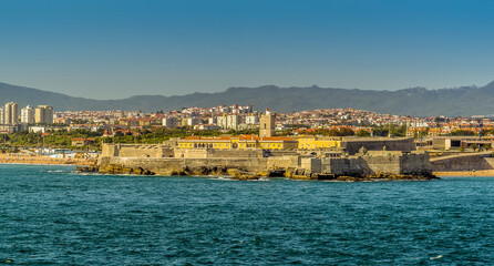 A view towards the Lombos district of Lisbon, Portugal at the mouth of the Tagus river.