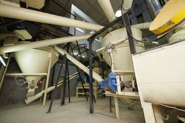 Equipment for mixing ingredients in an animal feed plant